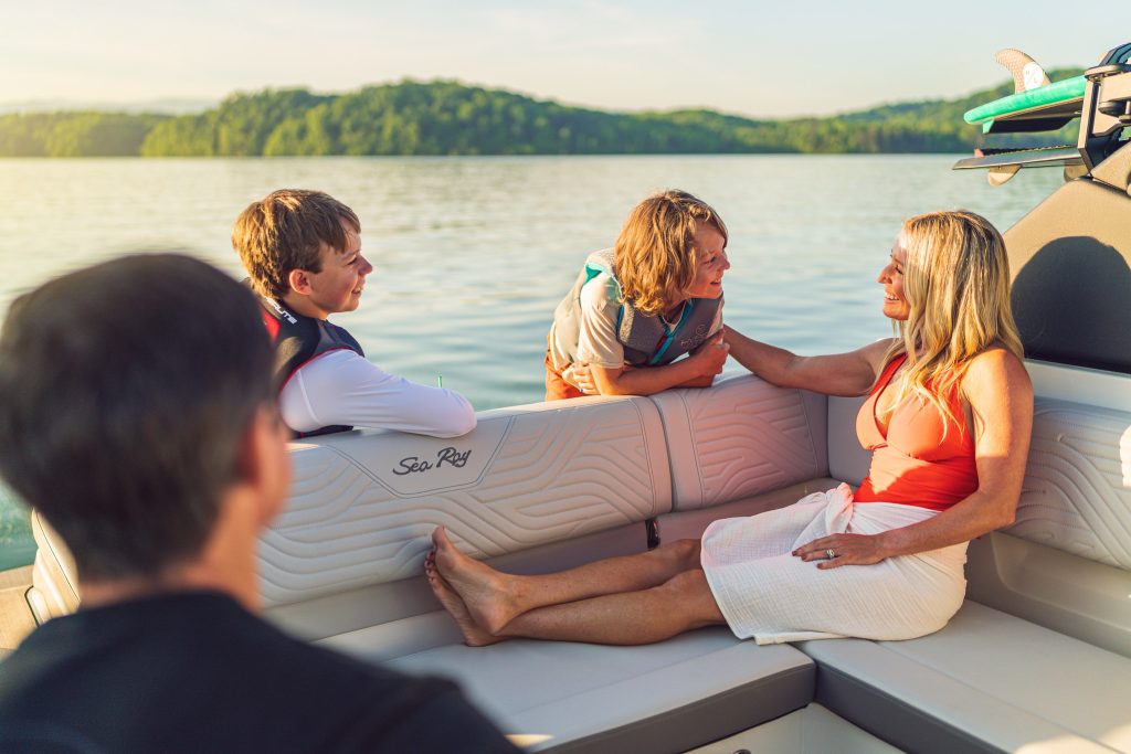 Family aboard an SDX 230 Surf
