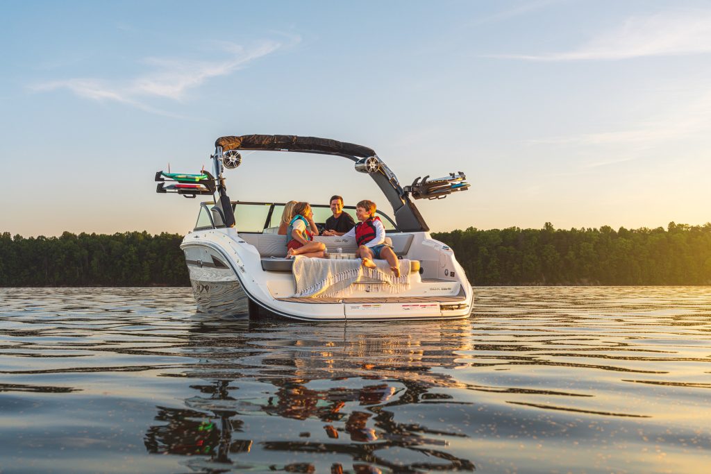 Family aboard an SDX 230 Surf