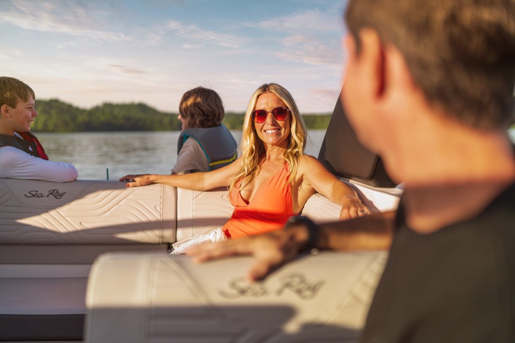 Family aboard an SDX 230 Surf