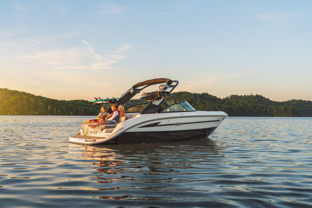 Family aboard an SDX 230 Surf
