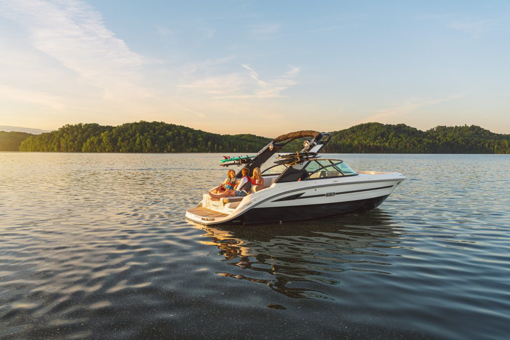 Family aboard an SDX 230 Surf