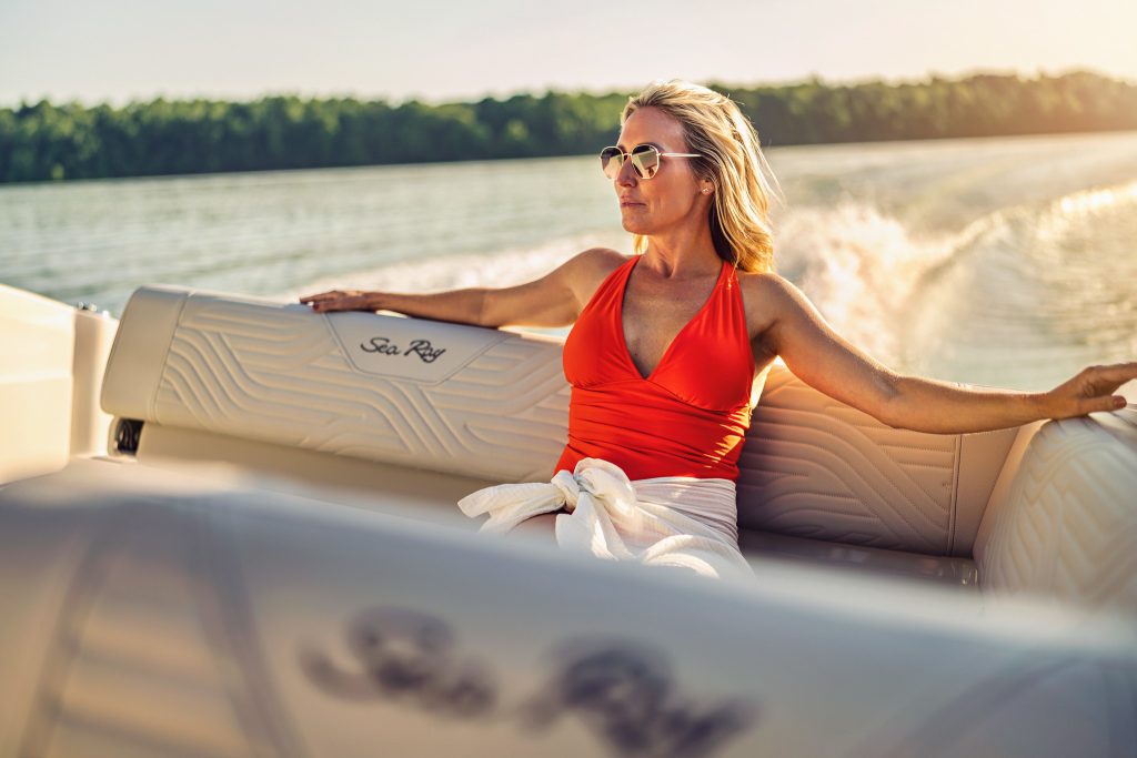 Woman aboard an SDX 230 Surf