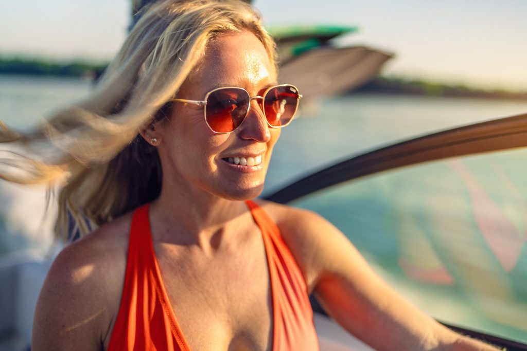 Woman aboard an SDX 230 Surf