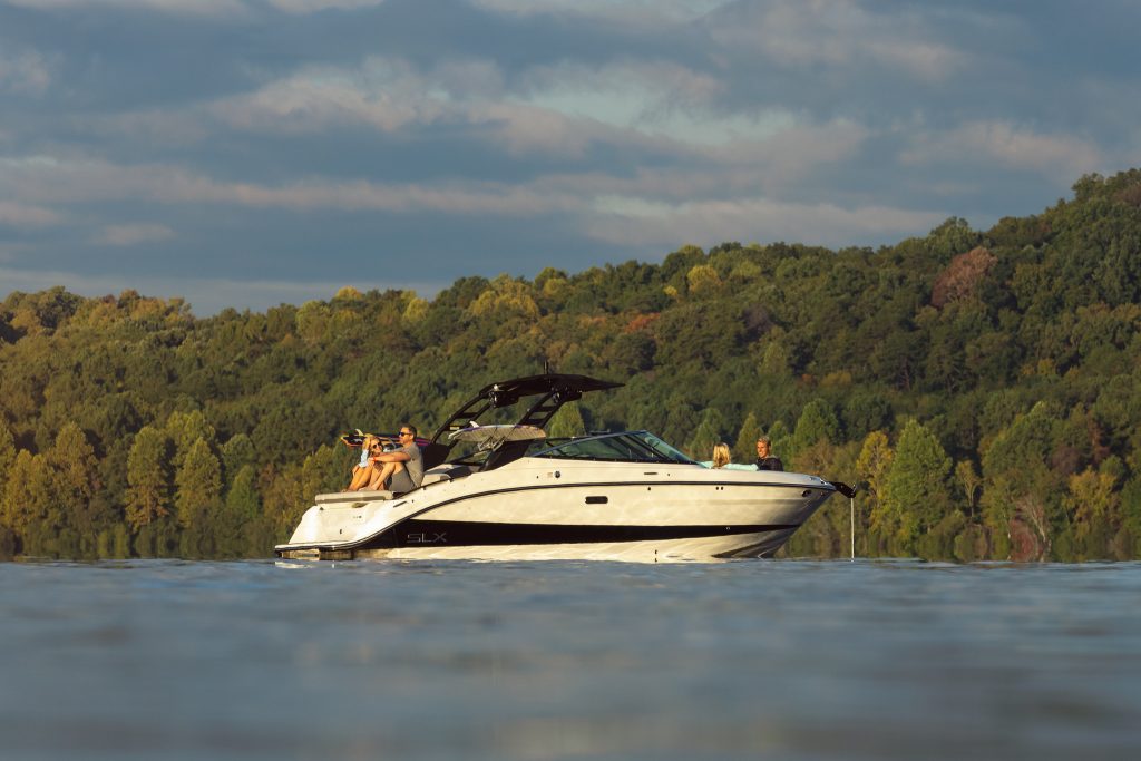 Family aboard an SLX 260 Surf