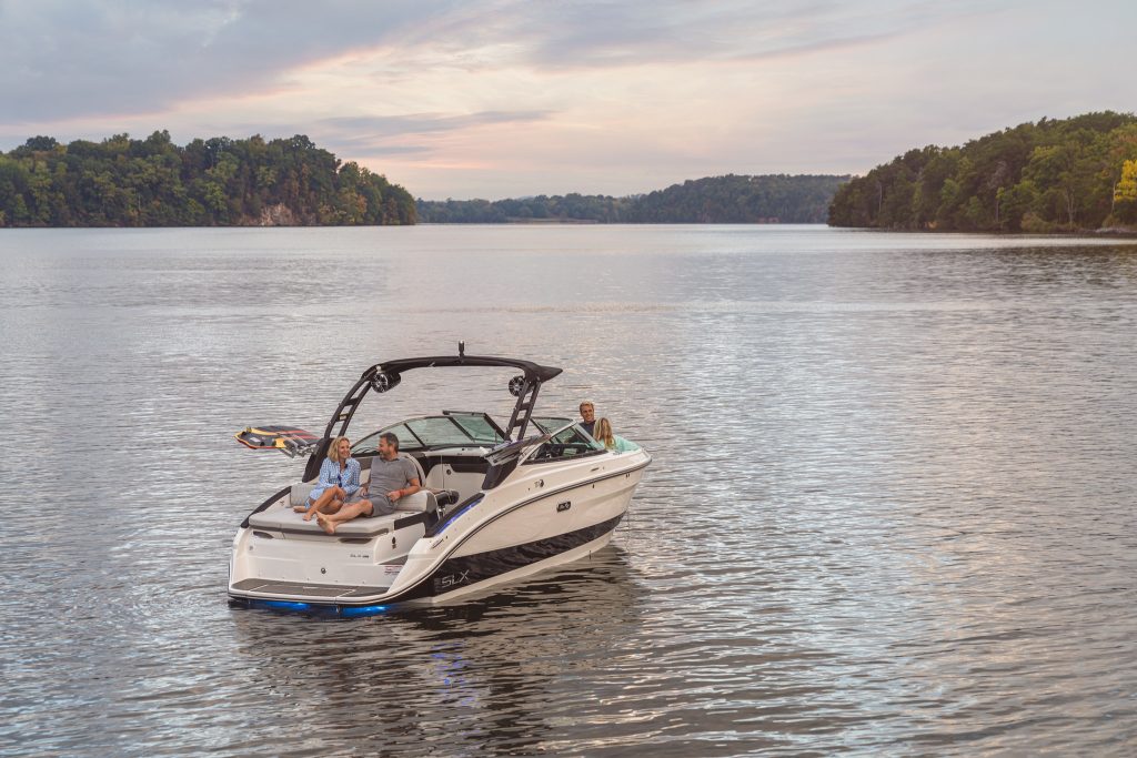 Family aboard an SLX 260 Surf
