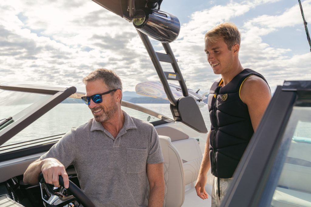 Father and son at the helm of an SLX 260 Surf