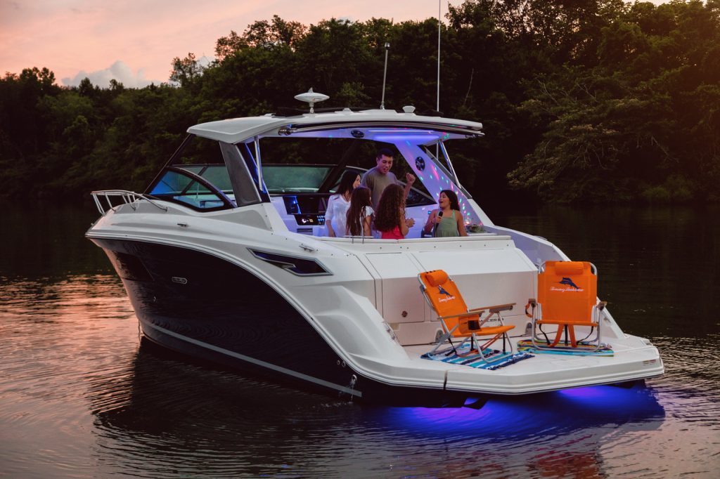 Family enjoying a fun evening aboard a Sundancer 320