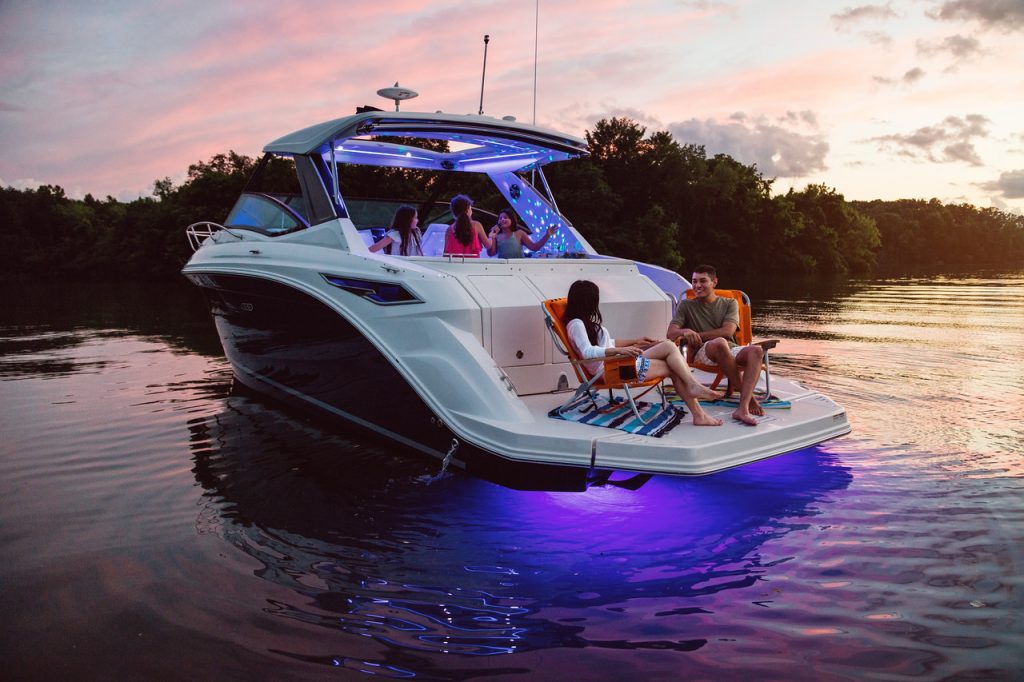Family enjoying a fun evening aboard a Sundancer 320