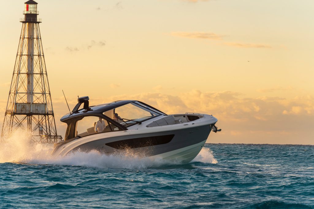 Sundancer 370 Outboard with a lighthouse in the background